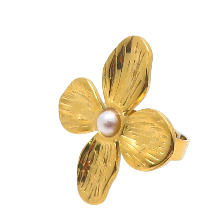 Gold flower-shaped ring with a pearl center on a white background