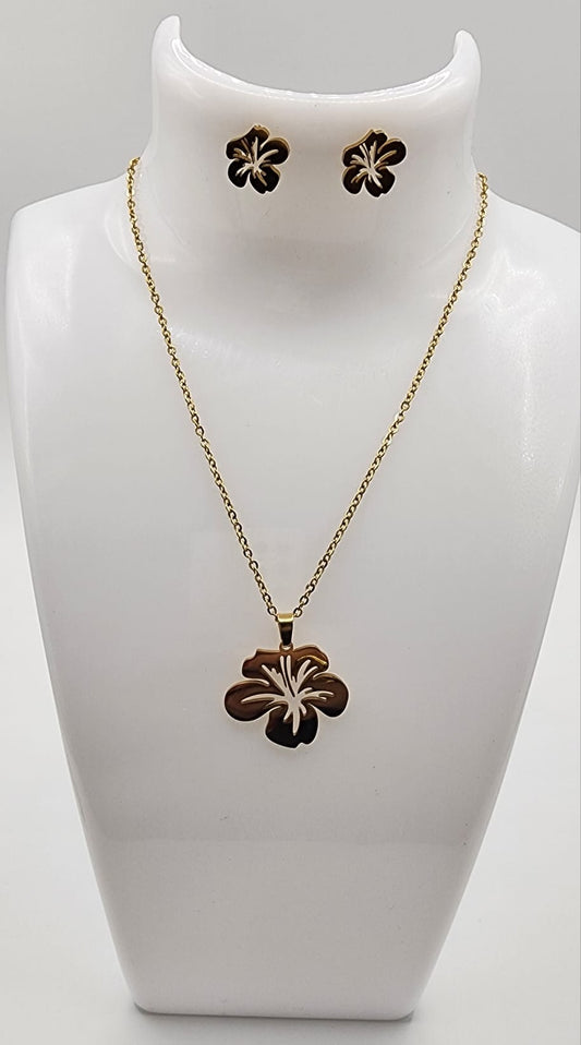 Jewelry set with necklace and earrings on a white mannequin bust