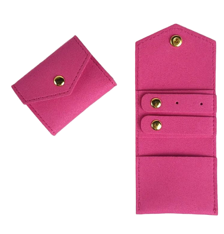 Pink fabric wallet with gold buttons on a white background